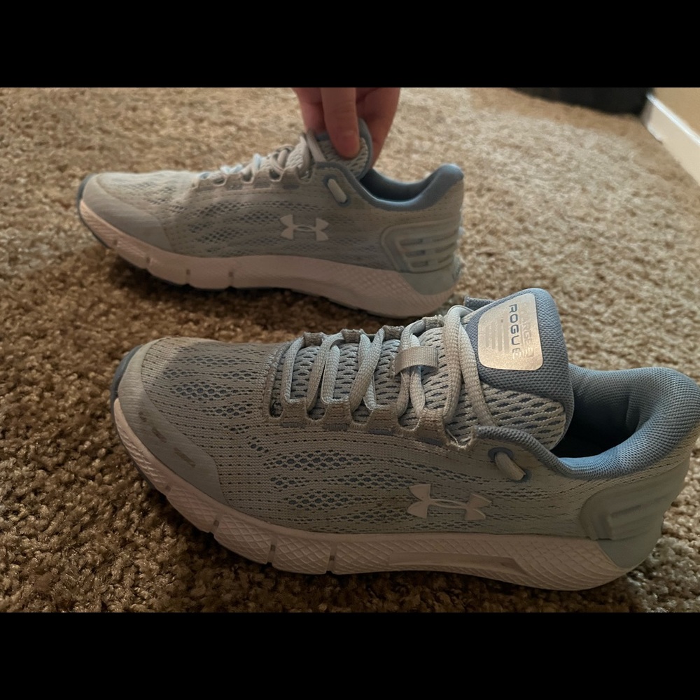 Blue Under Armour shoes.